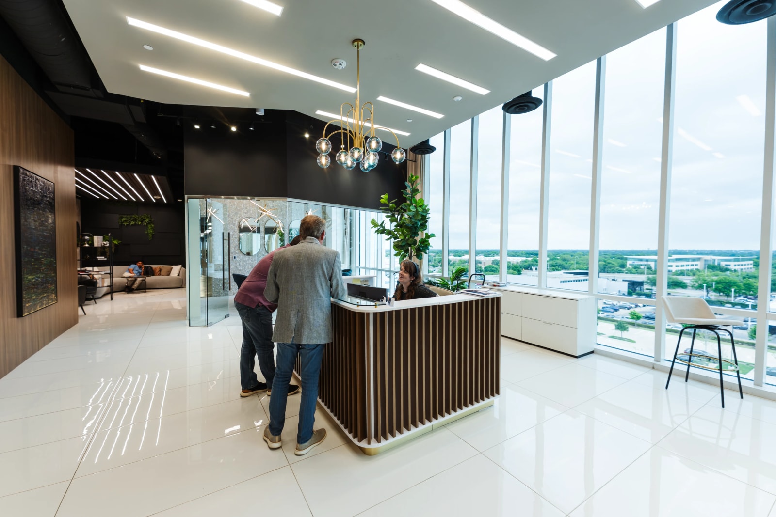 Modern reception lounge at Lucid Private Offices West Plano Willow Bend with panoramic views and premium amenities.