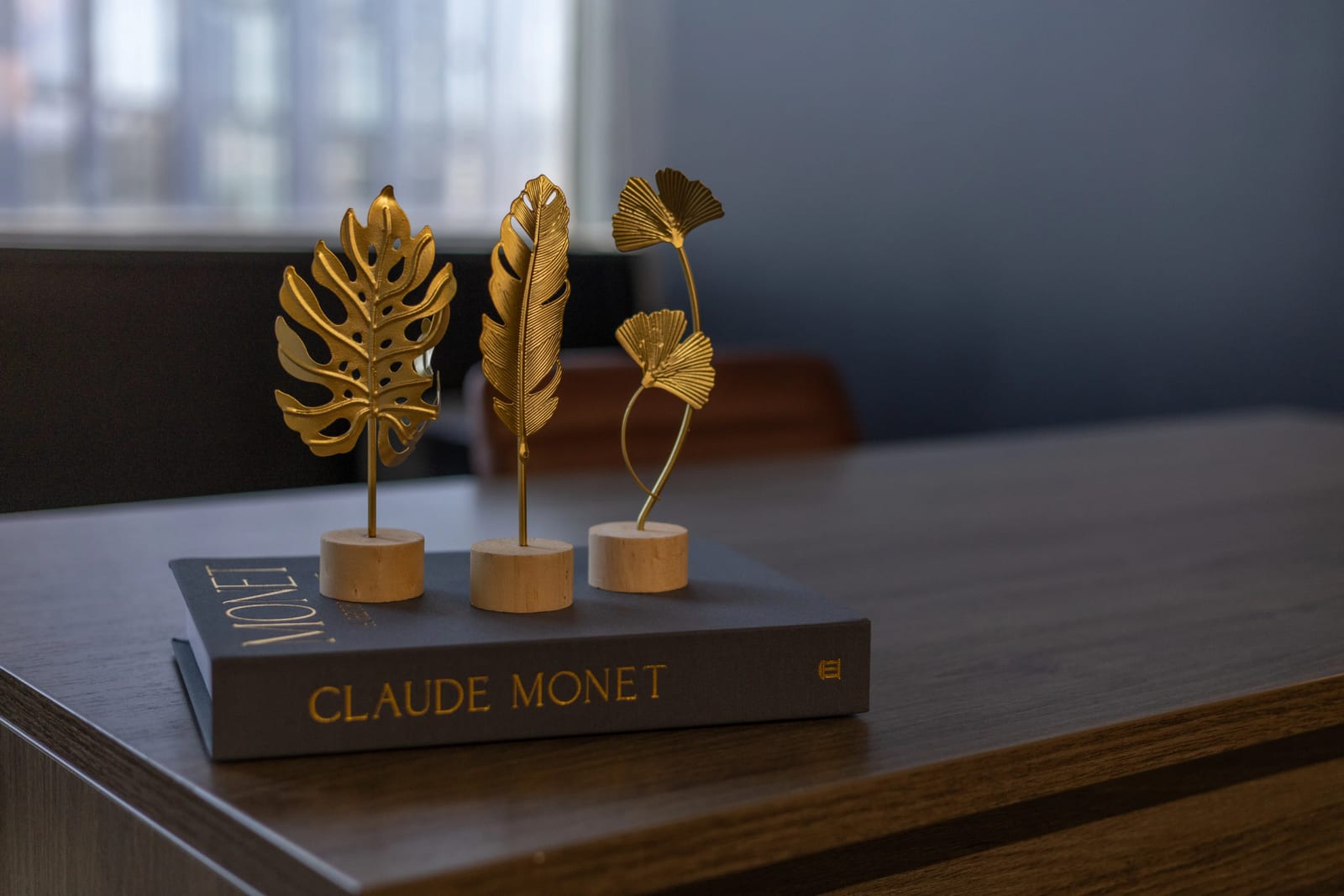 Gold leaf decor on a design book in a Lucid Private Offices office