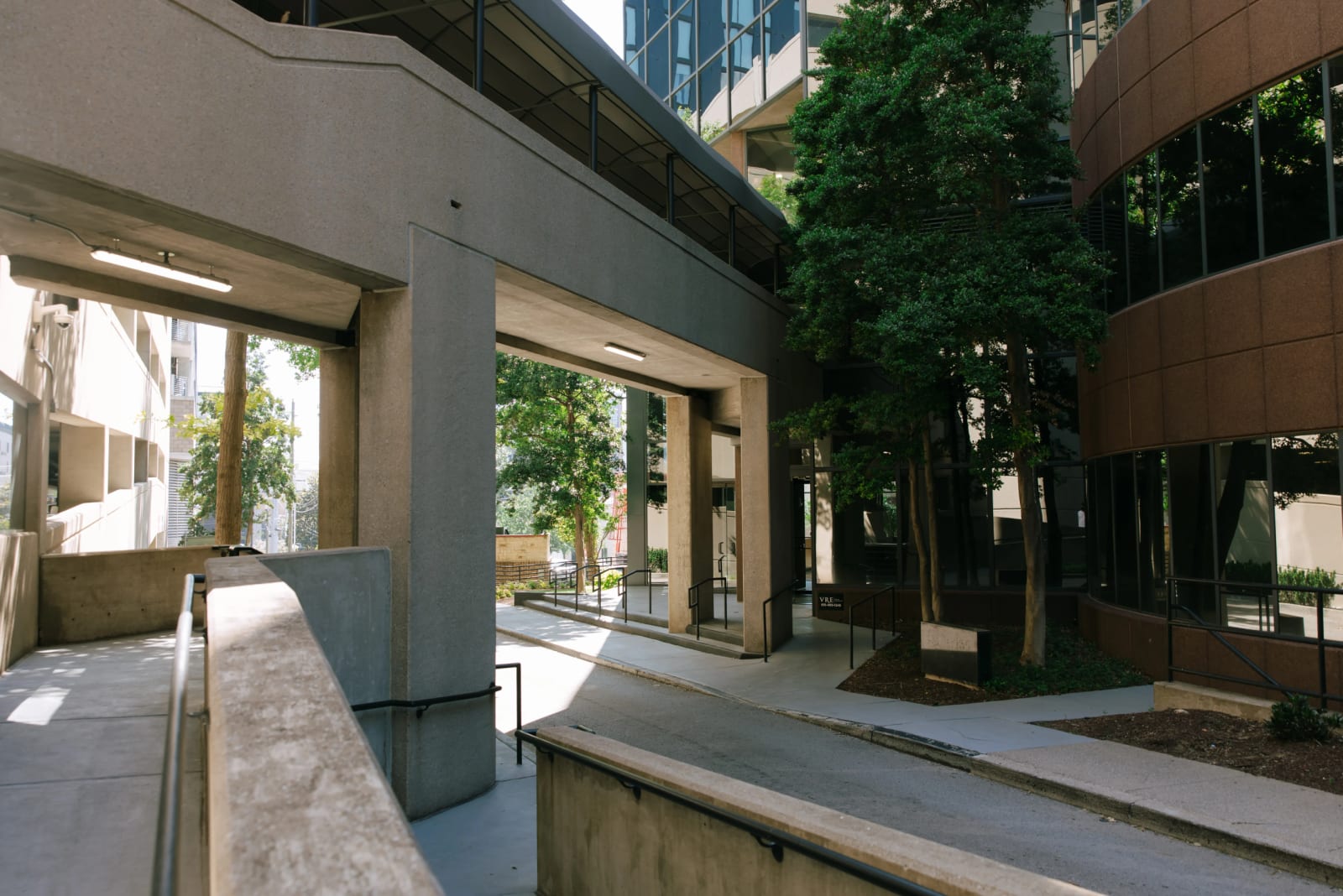 Walkway beside a modern glass office building