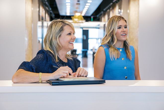 Two women at the reception desk at Lucid Private Offices
