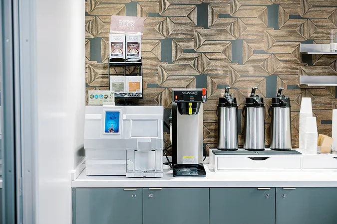 Coffee lounge espresso bar with professional machines at Lucid Private Offices Uptown Dallas coworking space