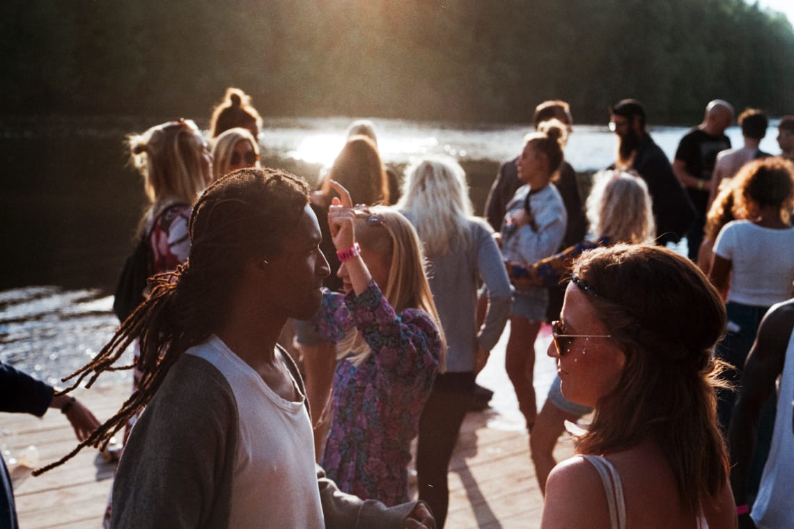 Young people mingling at an outdoor social gathering