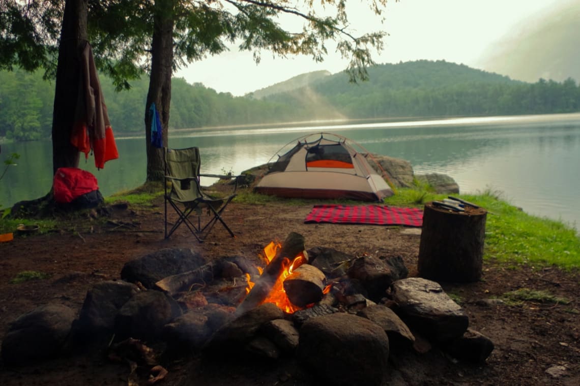 Bonfire in lakeshore campsite 