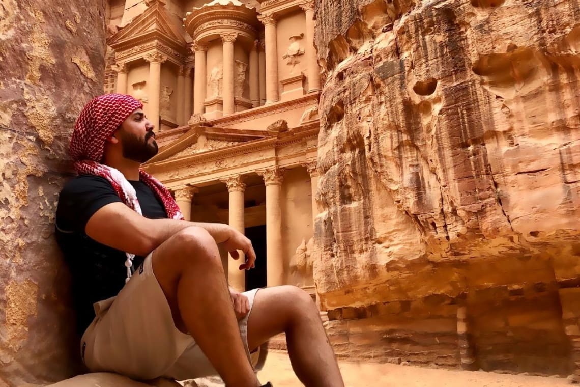 Guy sitting in Petra Archaeological Site