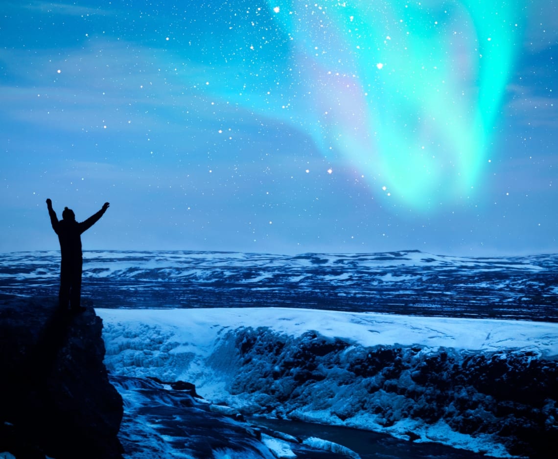 Person looking at Northern Lights in the dark in Iceland