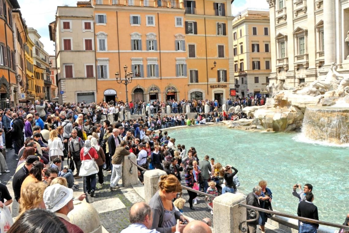 Crowd of tourists in Trevi Fountain, Rome