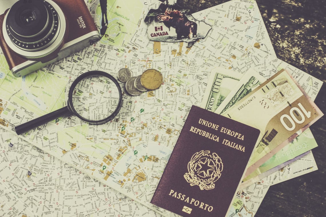 Passport, maps, camera, and currency