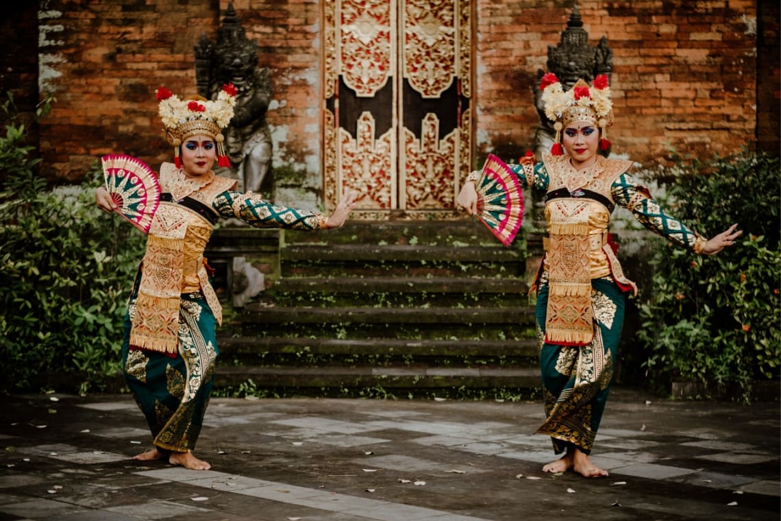 Two women dancing traditional Balinese dance