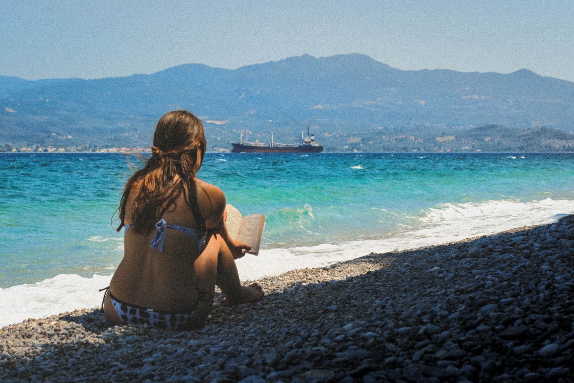 Girl enjoying alone time by the beach, Glifa, Greece