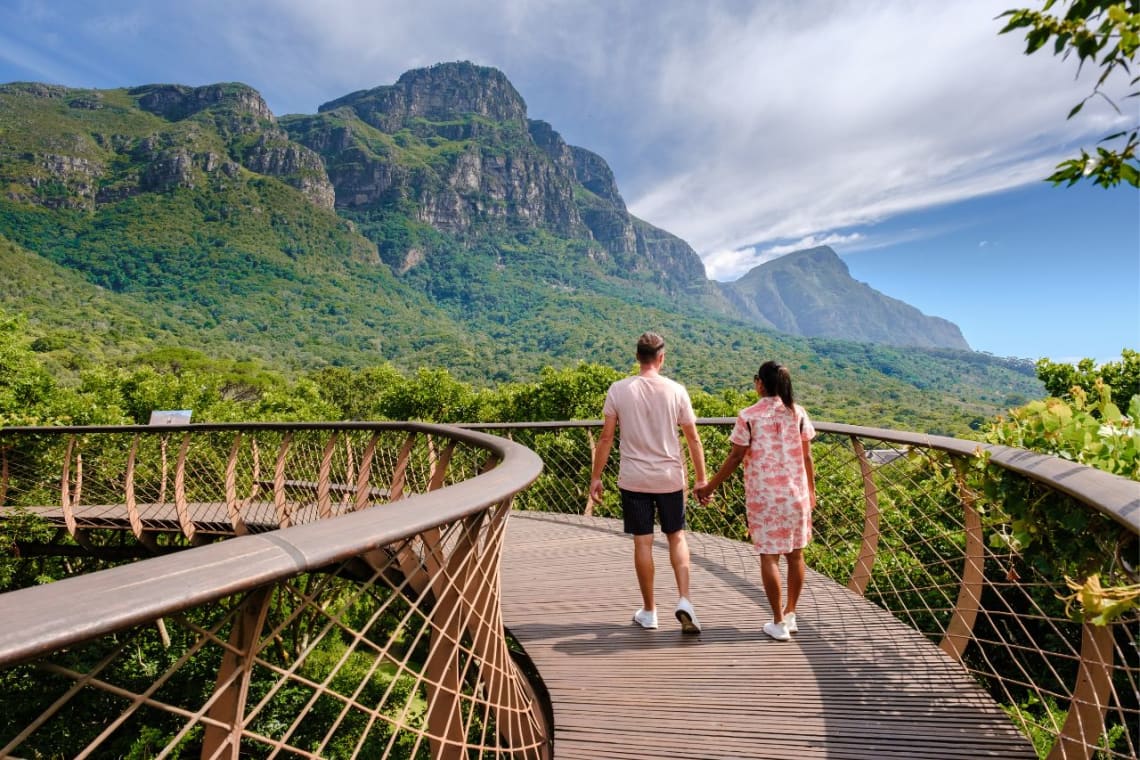 Couple walking on a boardwalk in Kirstenbosch Botanical Garden