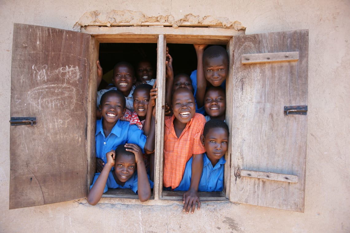 Children smiling at school, Uganda