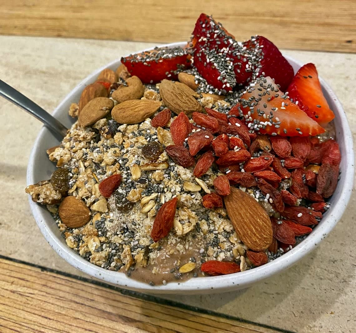 Smoothie bowl full of nuts and fruits