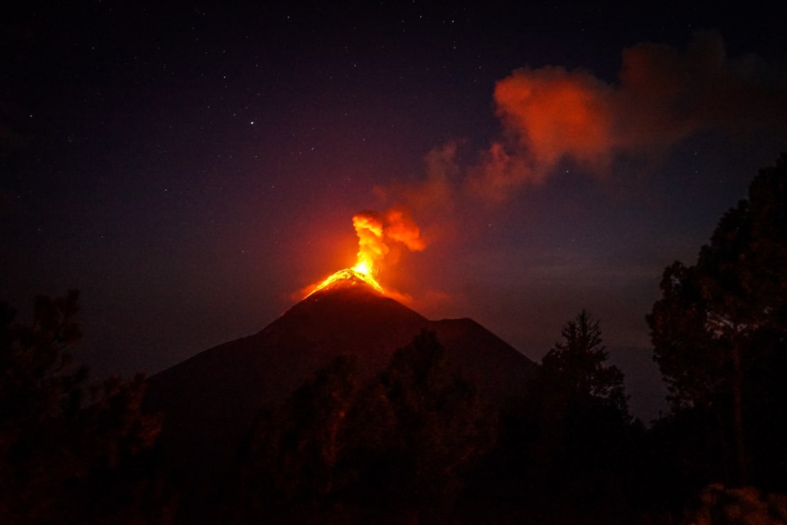 Night view of lava eruption at Fuego volcano, Guatemala