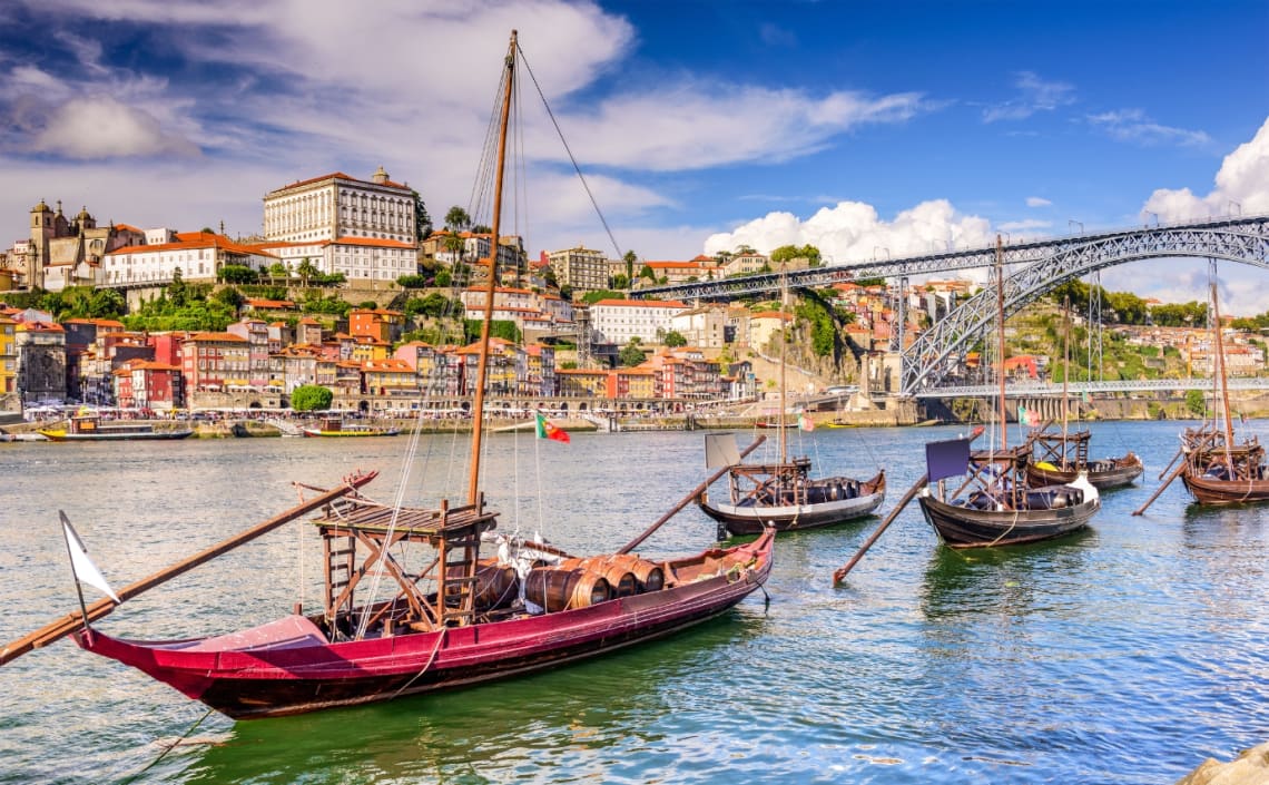 Riverside view of Porto, with boats sailing