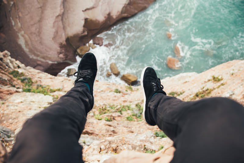 Sneakers in contrast to an ocean view