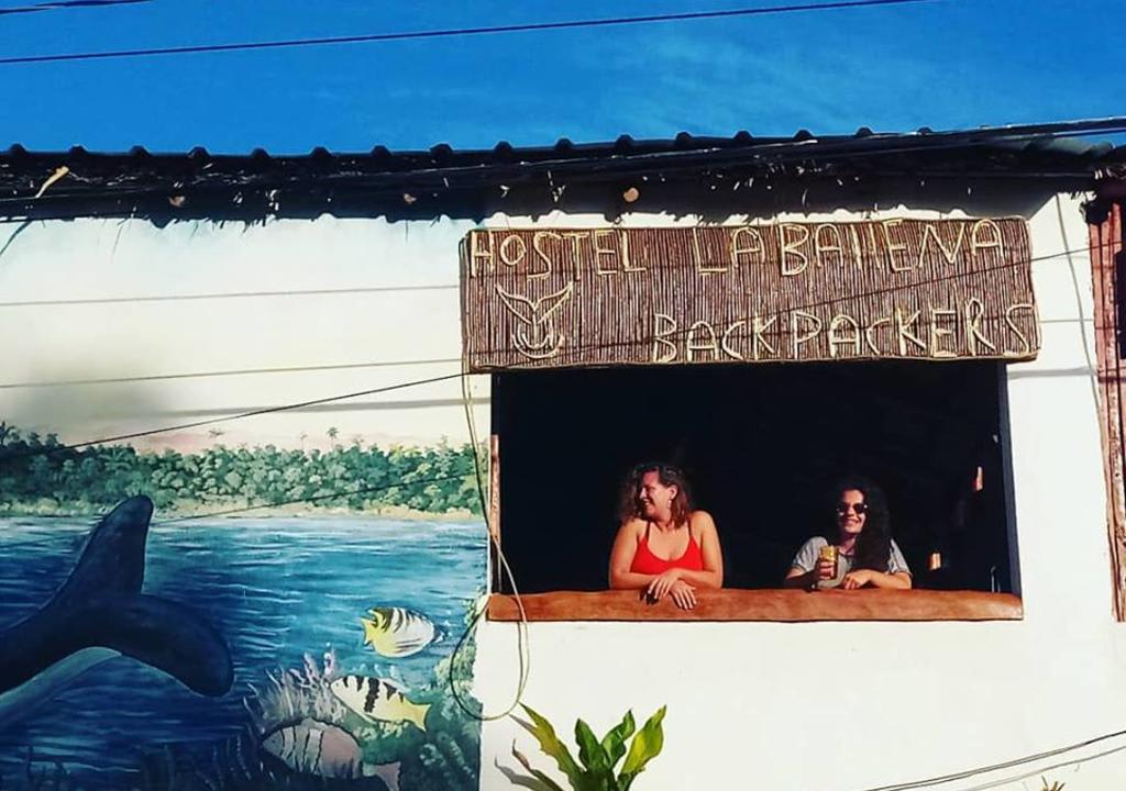 Two girls in a hostel entrance. Staying in a hostel is a great way to learn Spanish