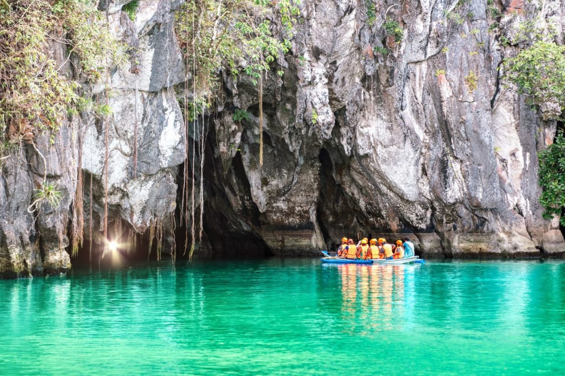 Philippines travel guide: group on a boat entering the subterranean river