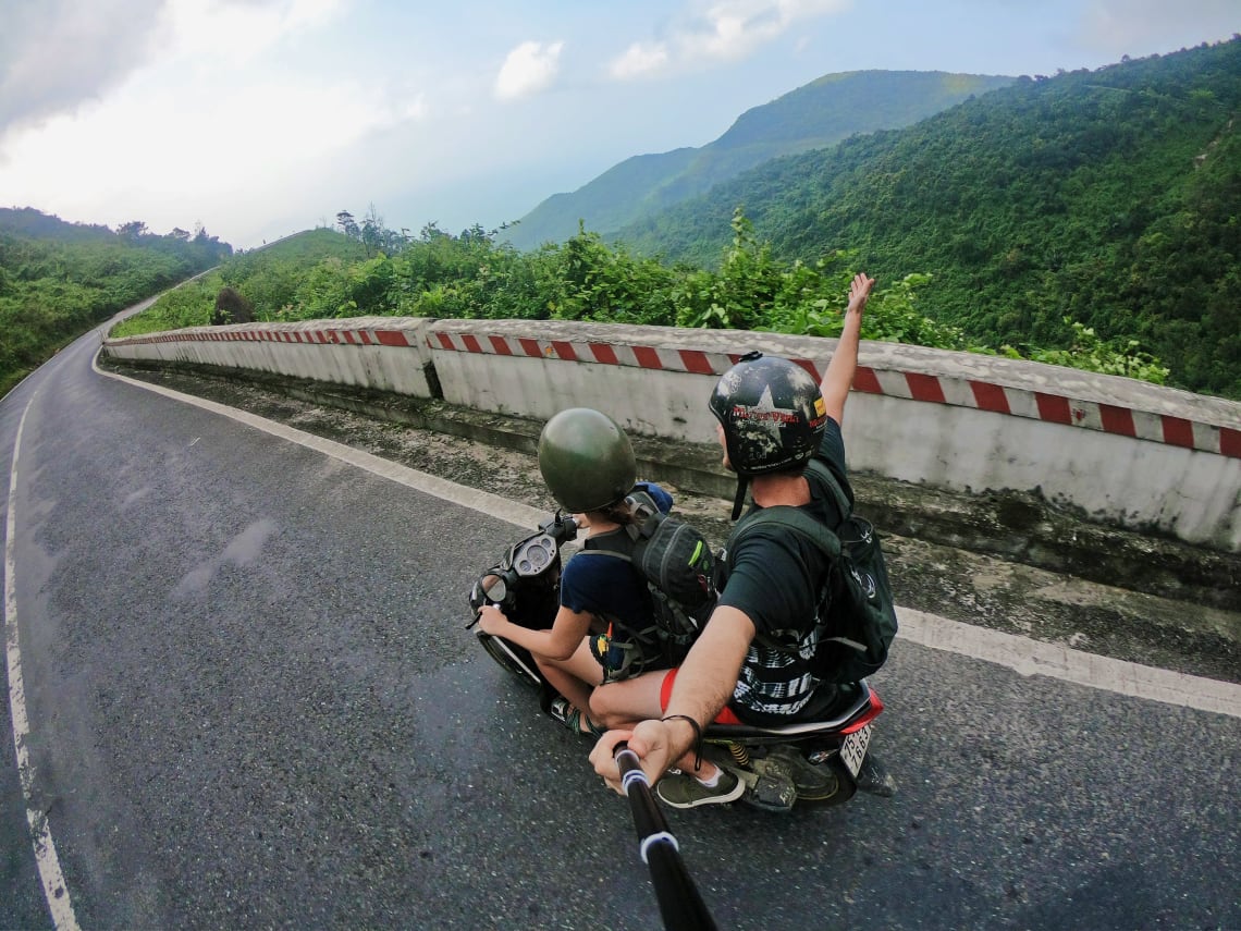 Travelers riding on a scooter in Vietnam