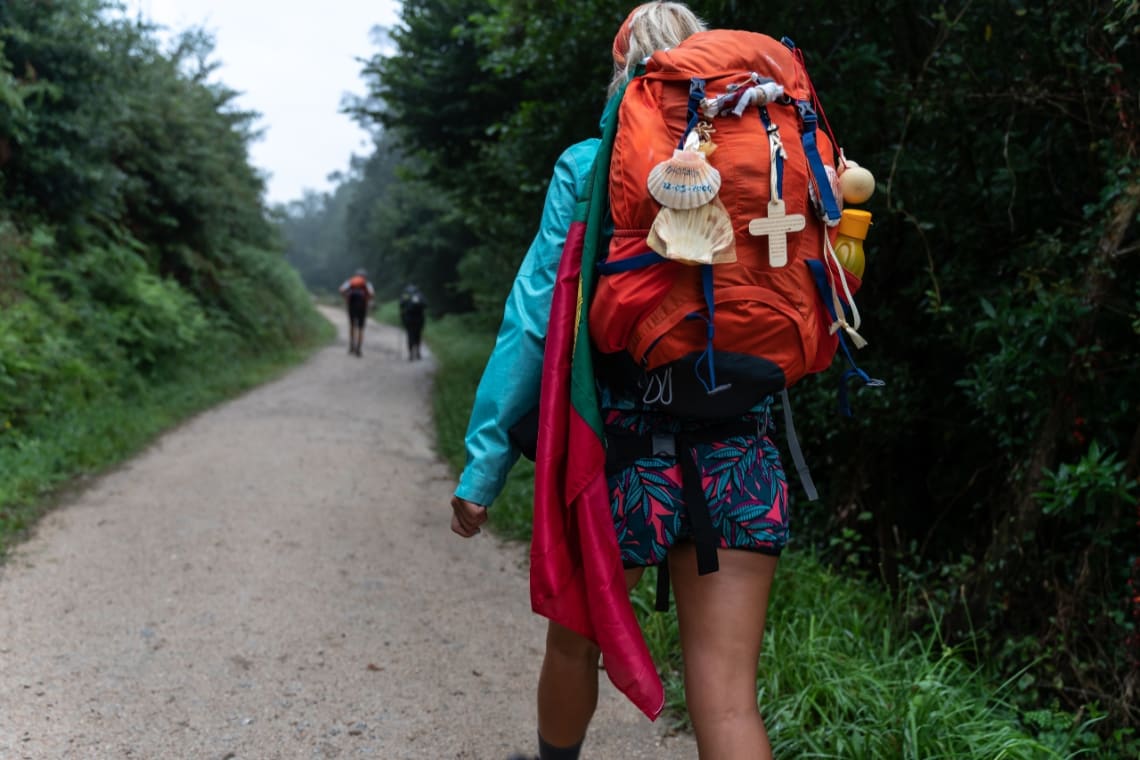 Girl with backpack in the Camino de Santiago 