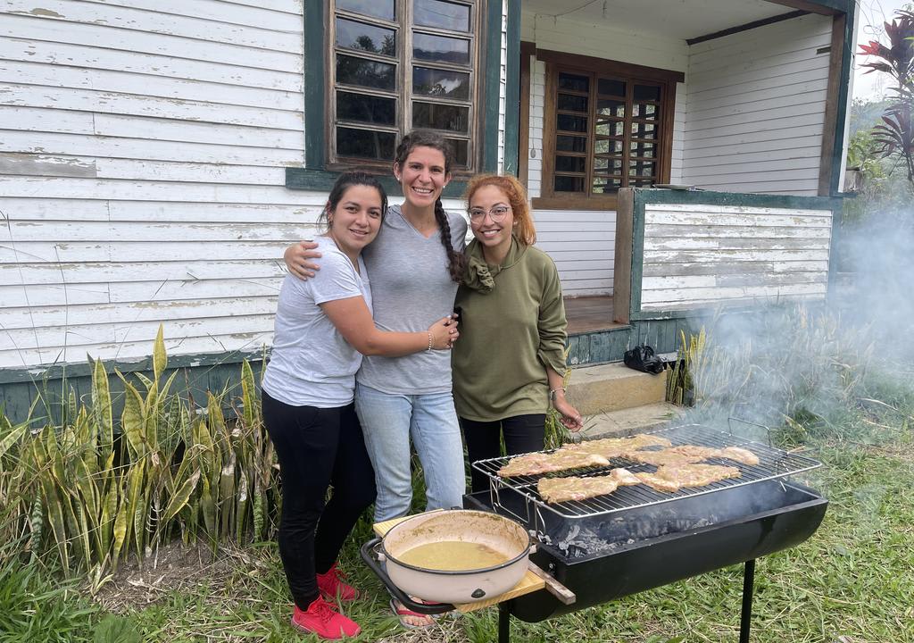 Three girls making a barbeque. Traveling is the best way to learn Spanish on your own