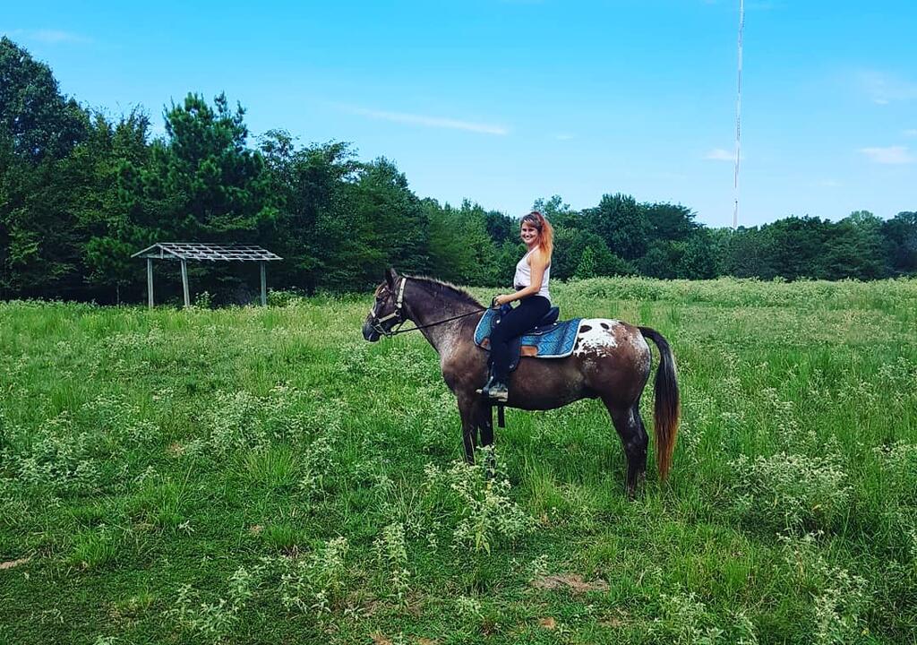 a girl horseback riding 