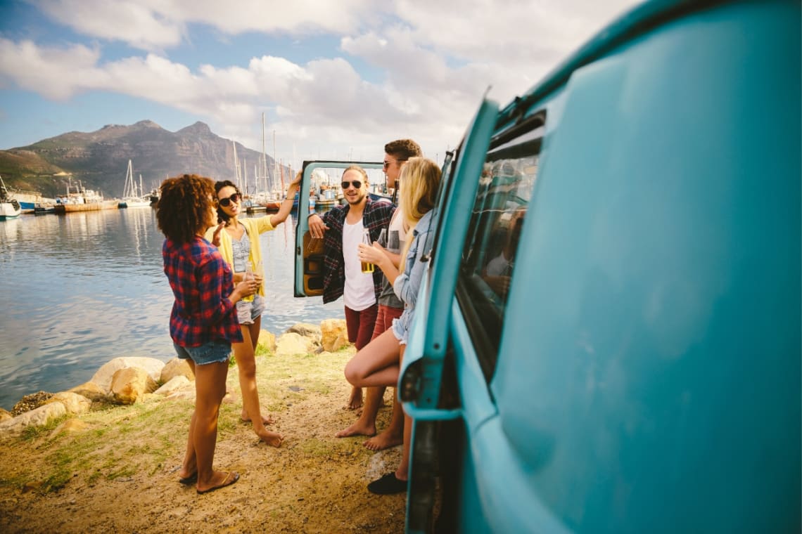 Travel partners chatting outside their travel van