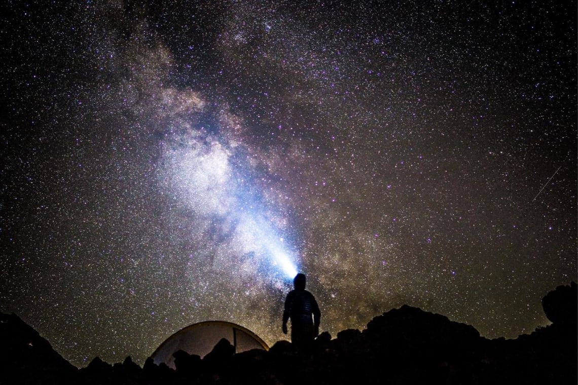 Bucket list adventures: Man stargazing in Spitzkopee, Namibia