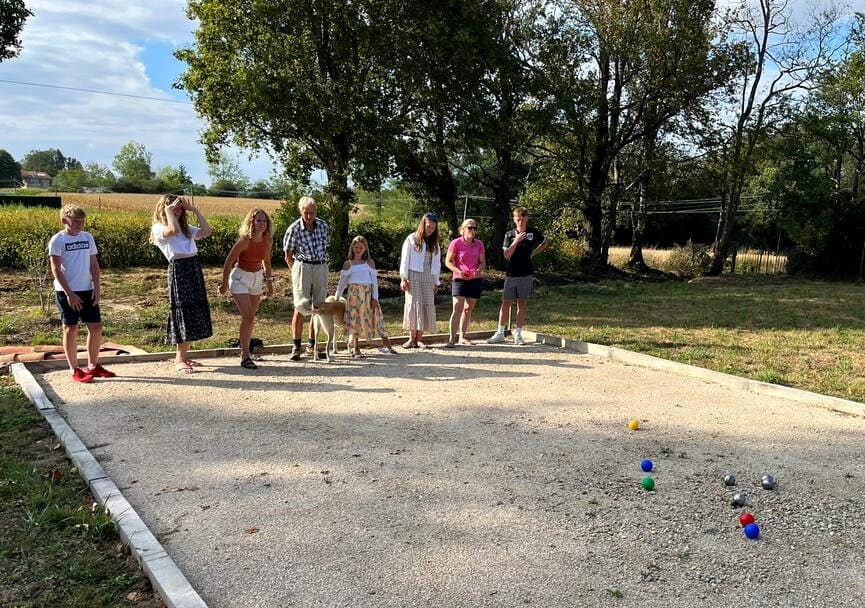 Host family meaning: family and guest playing petanque