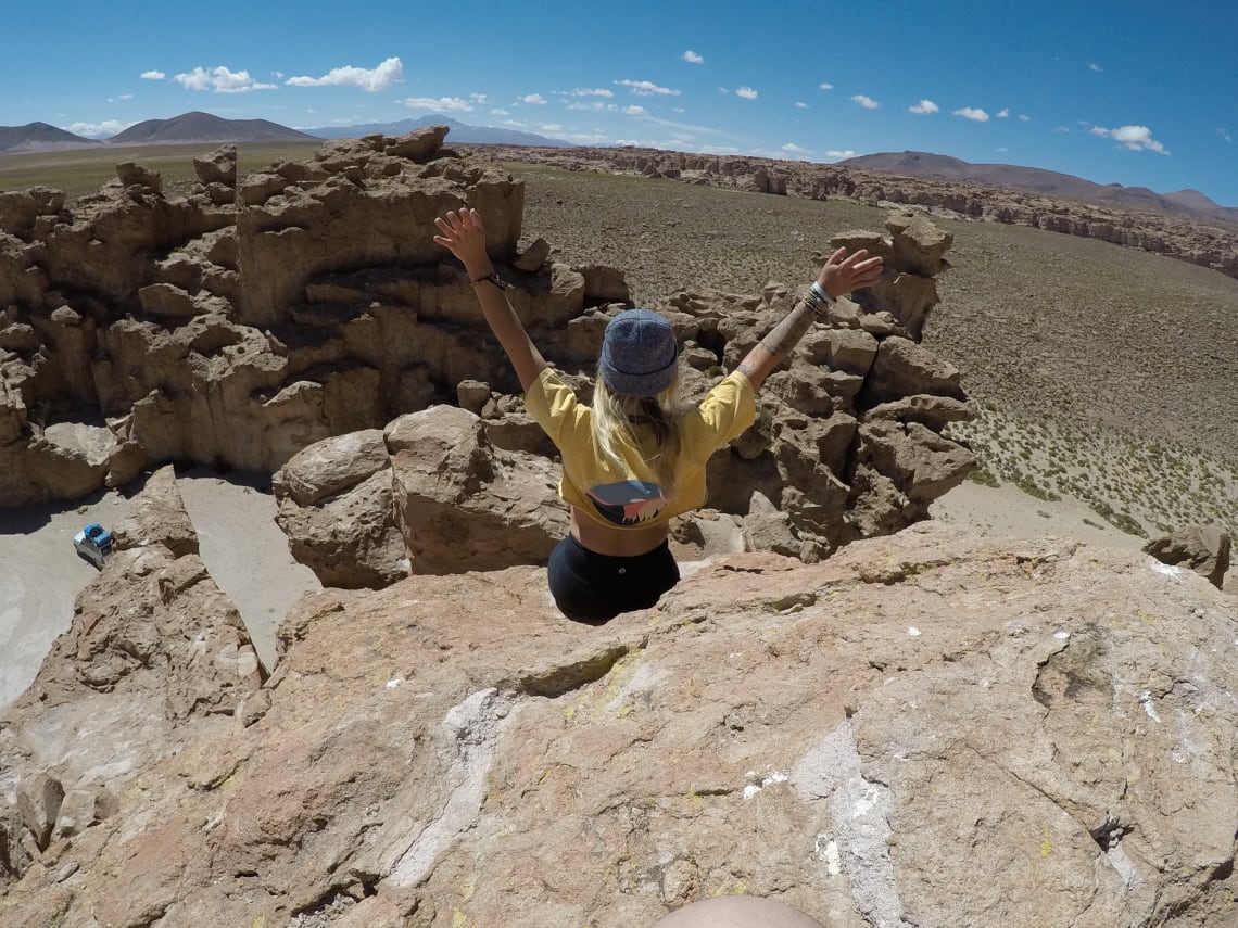 At the top of a rock in a rural environment