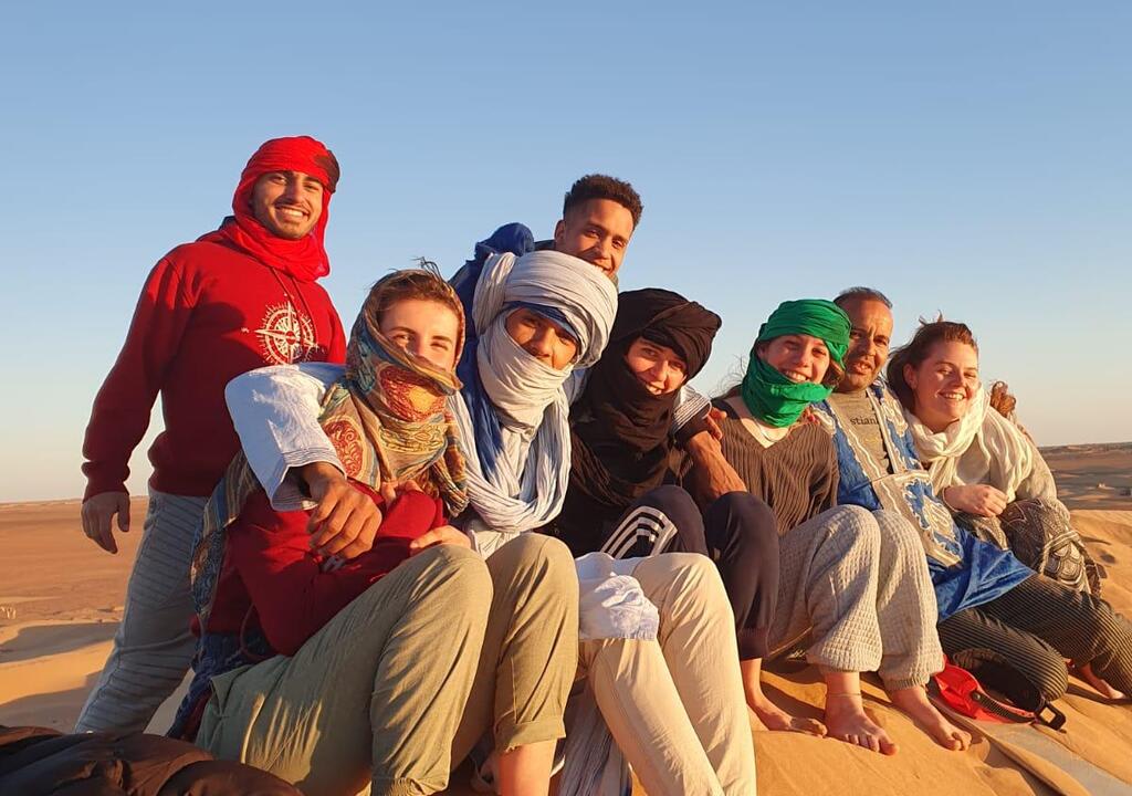 Worldpackers volunteers pose for photo in a desert