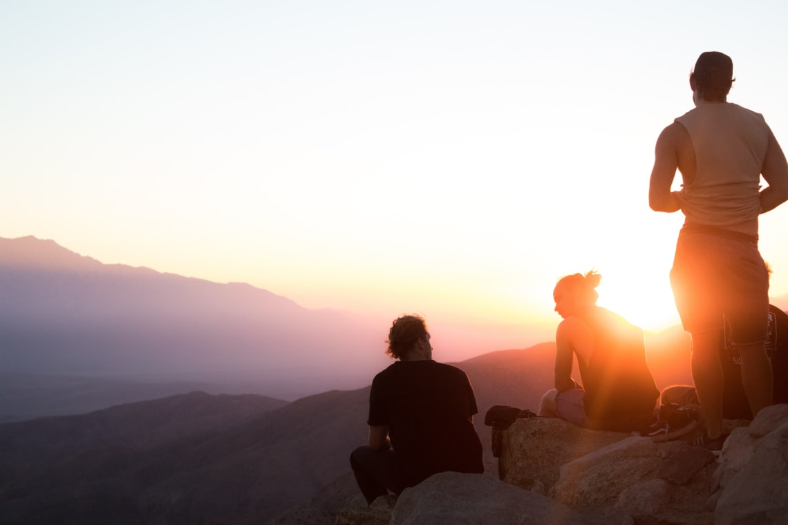 Travelers enjoying a sunset hike, Joshua Tree, California