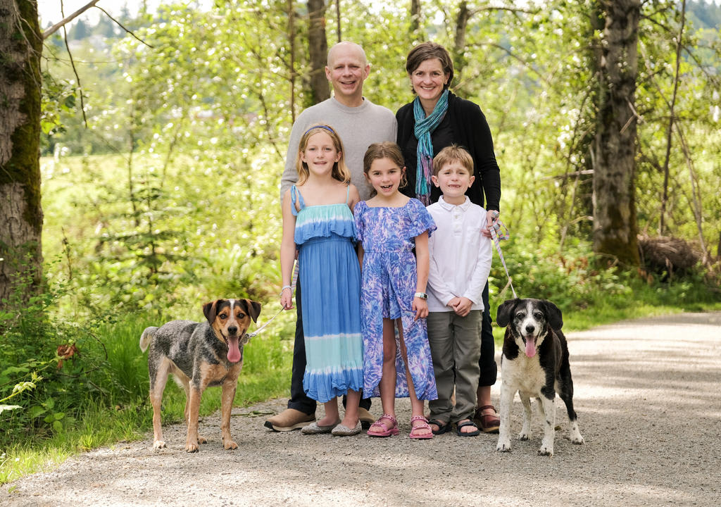 Family with three kids and two dogs