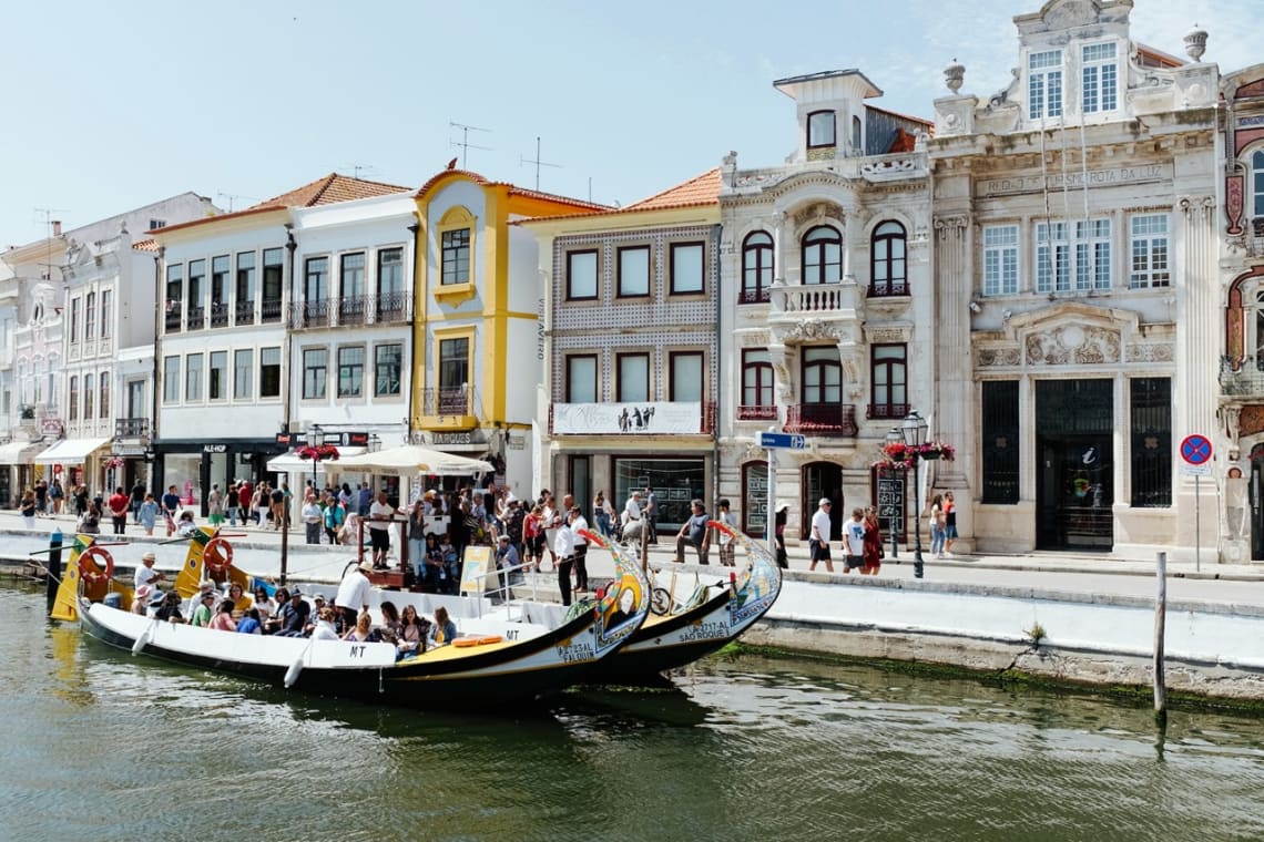 Ttraditional moliceiro boats of Aveiro sailing the canal