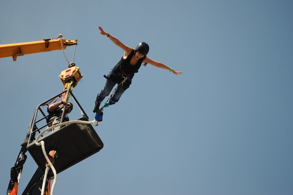 Bucket list adventures: Girl bungee jumping in New Zealand