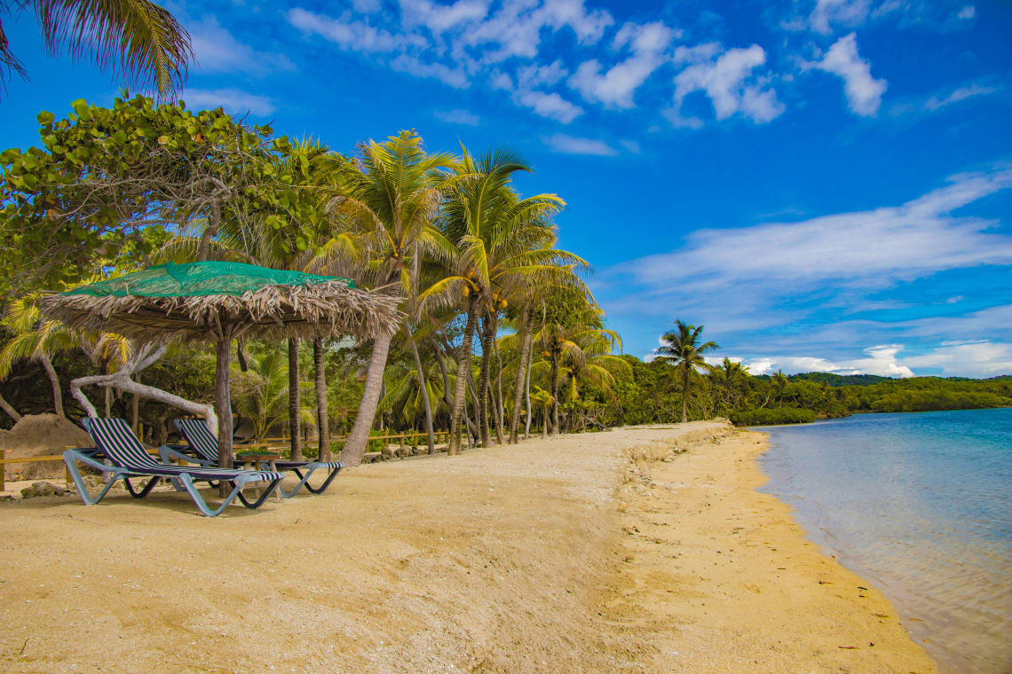 Tropical beach, one of the best things to do in Honduras