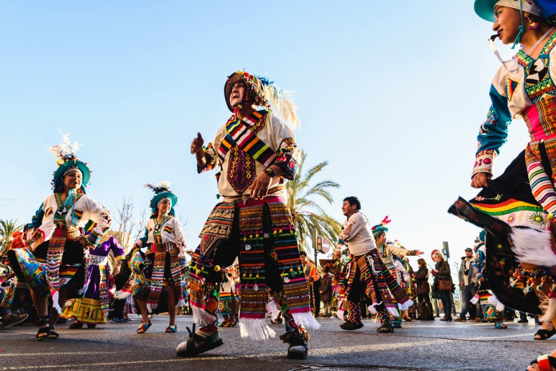 Local dancers dressed in traditional attire at a festival in Bolivia 