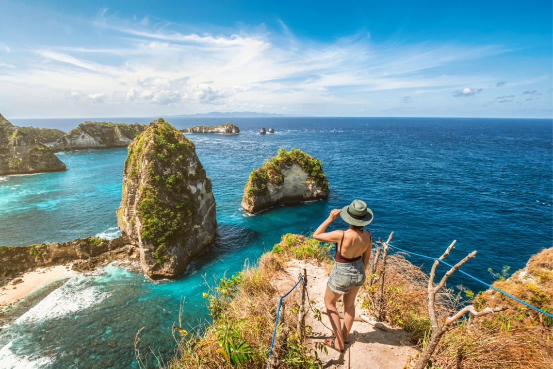 Girl looking at the sea from a lookout point