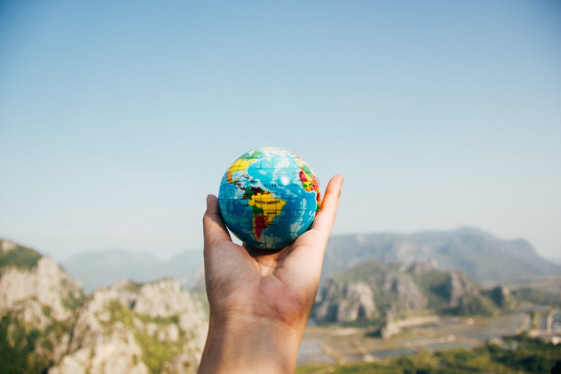 Holding a world globe