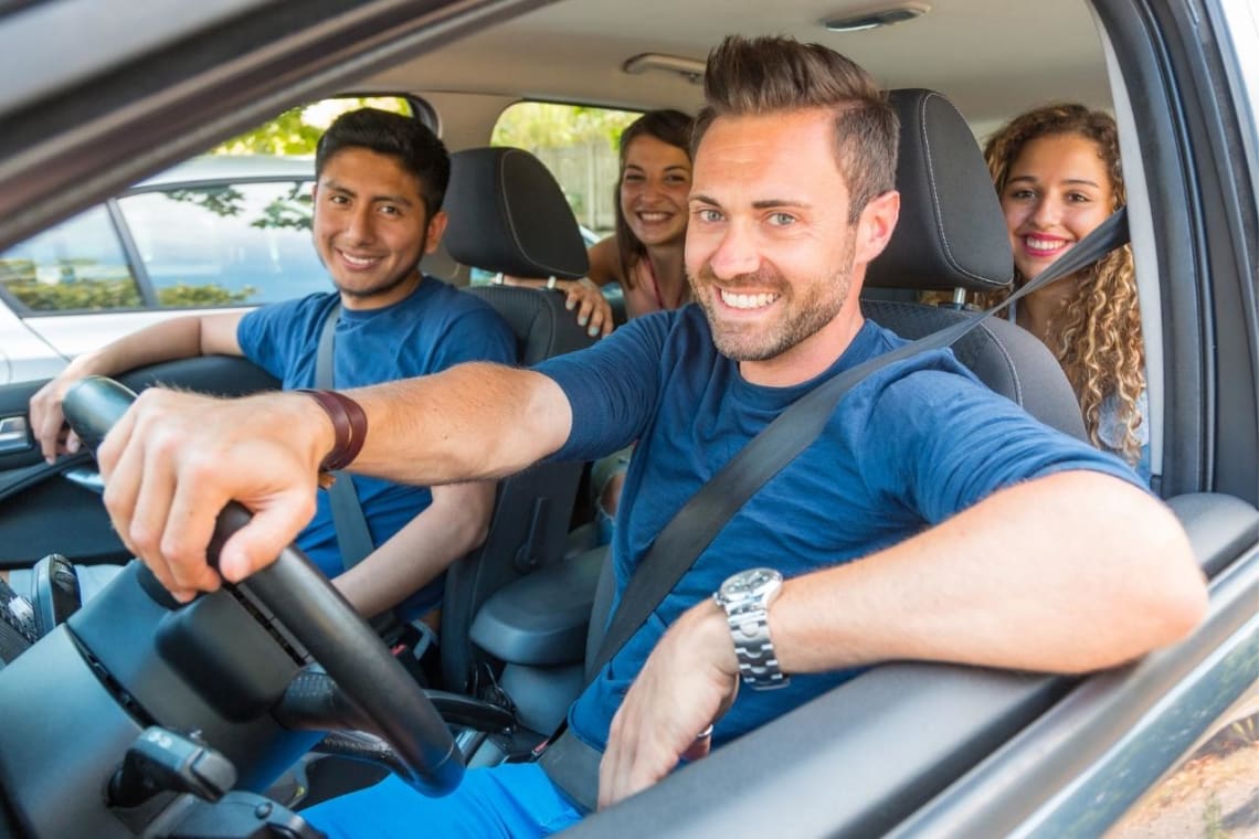 Group of four sharing a car ride