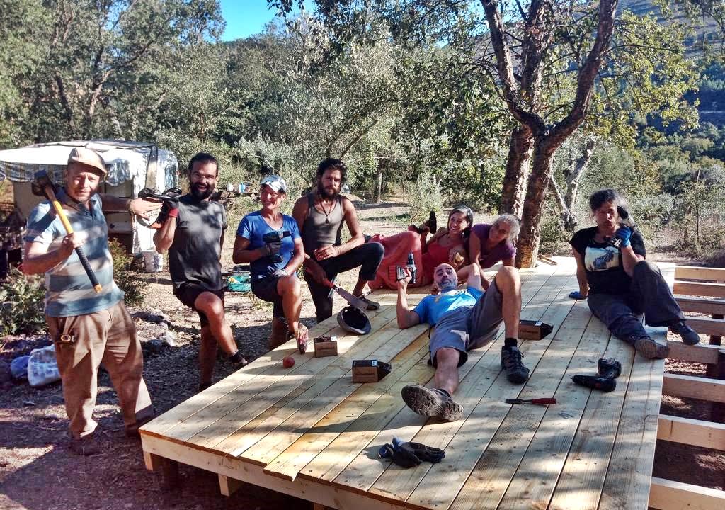Members of an off-the-grid community with construction tools