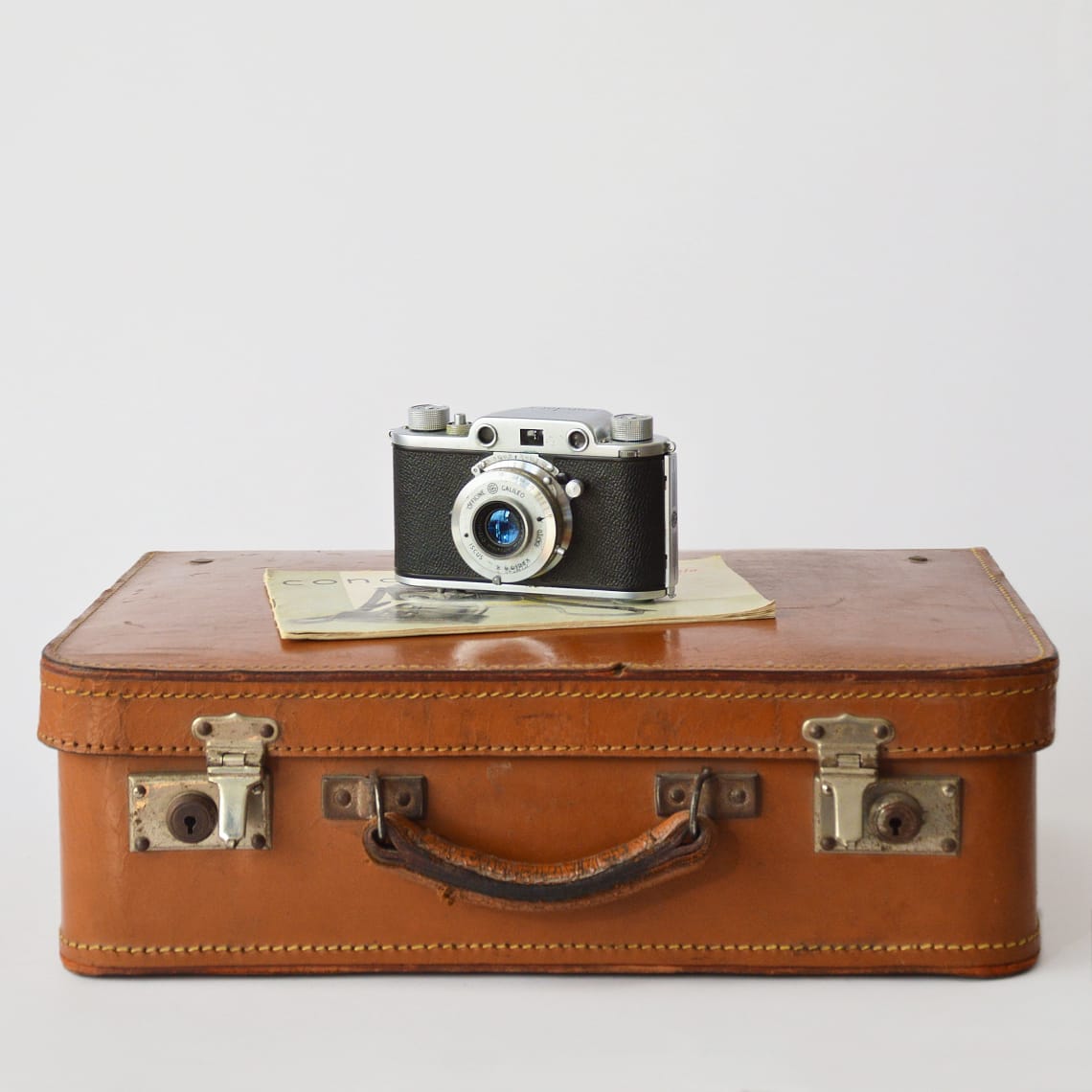 Vintage suitcase and camera