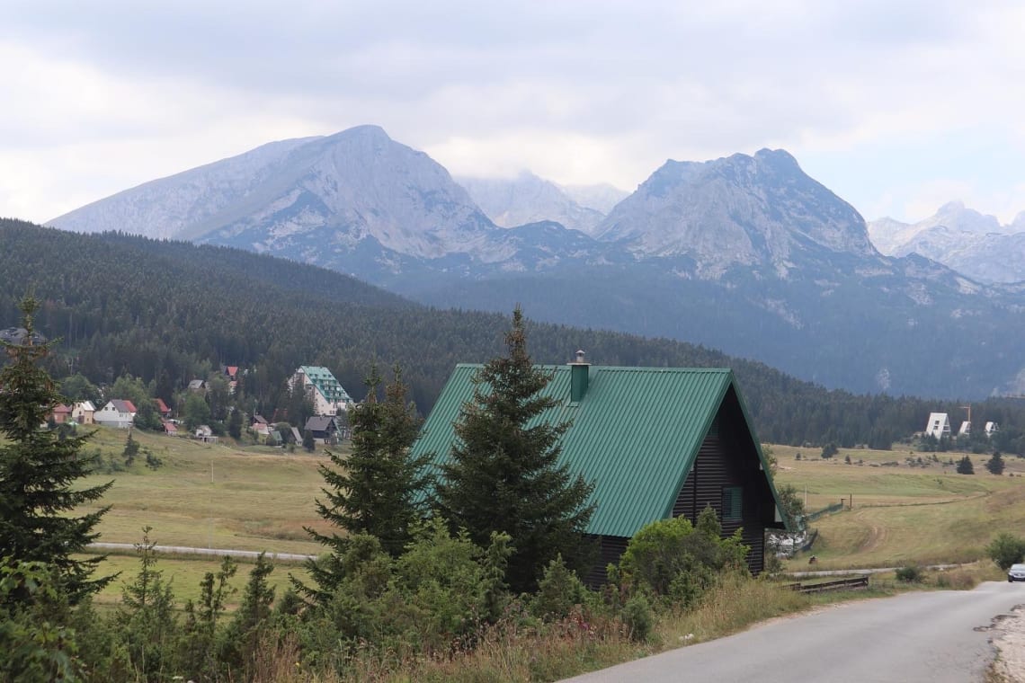 Rural road of Montenegro with mountains in the background