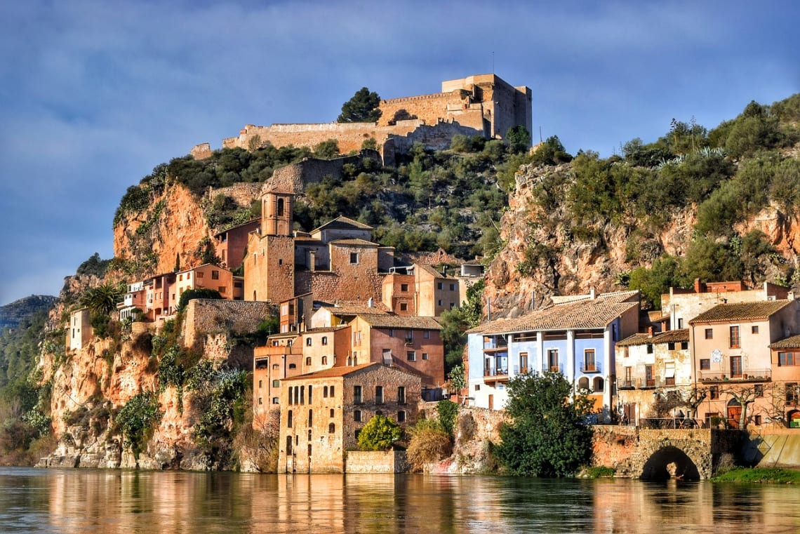planning a trip to Spain: small traditional village on a hillside facing the sea
