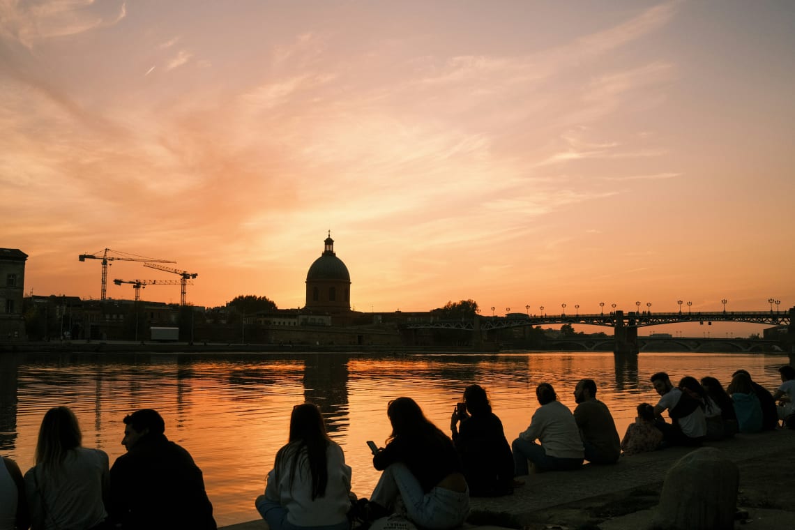 teaching English in France - young people gather by the river in Toulouse