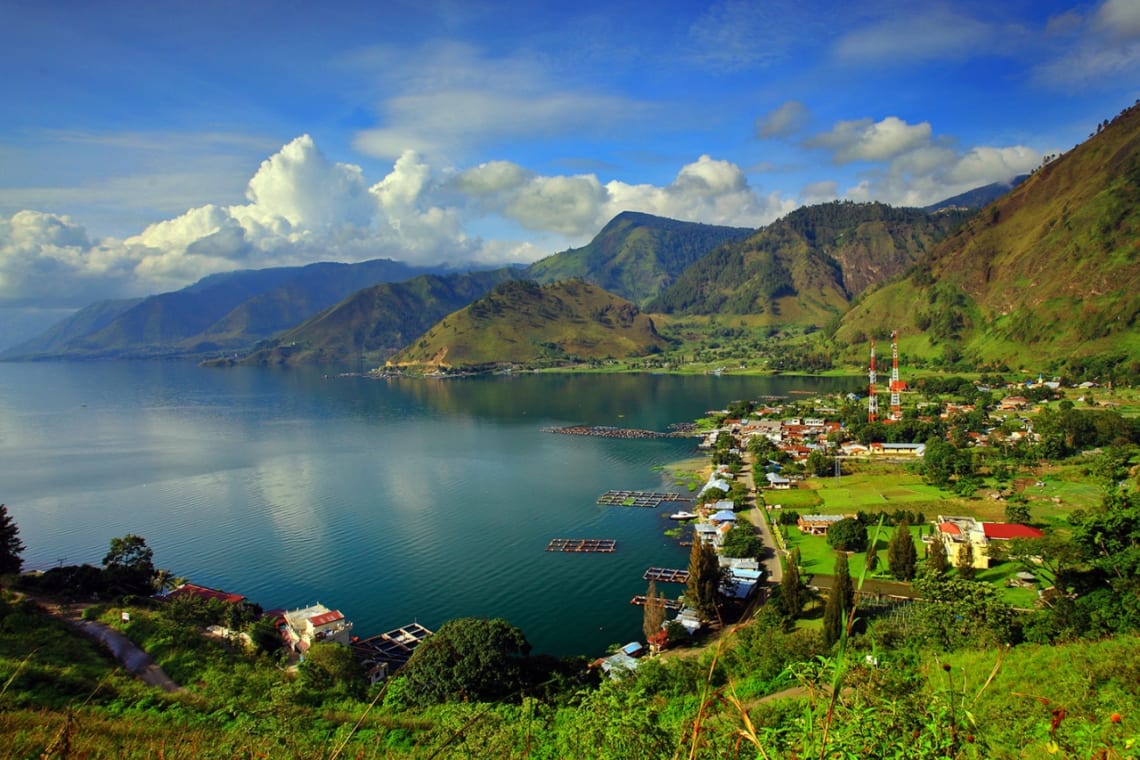 Indonesia trips: Lake Toba and village sorrounded by mountains seen from a lookout point