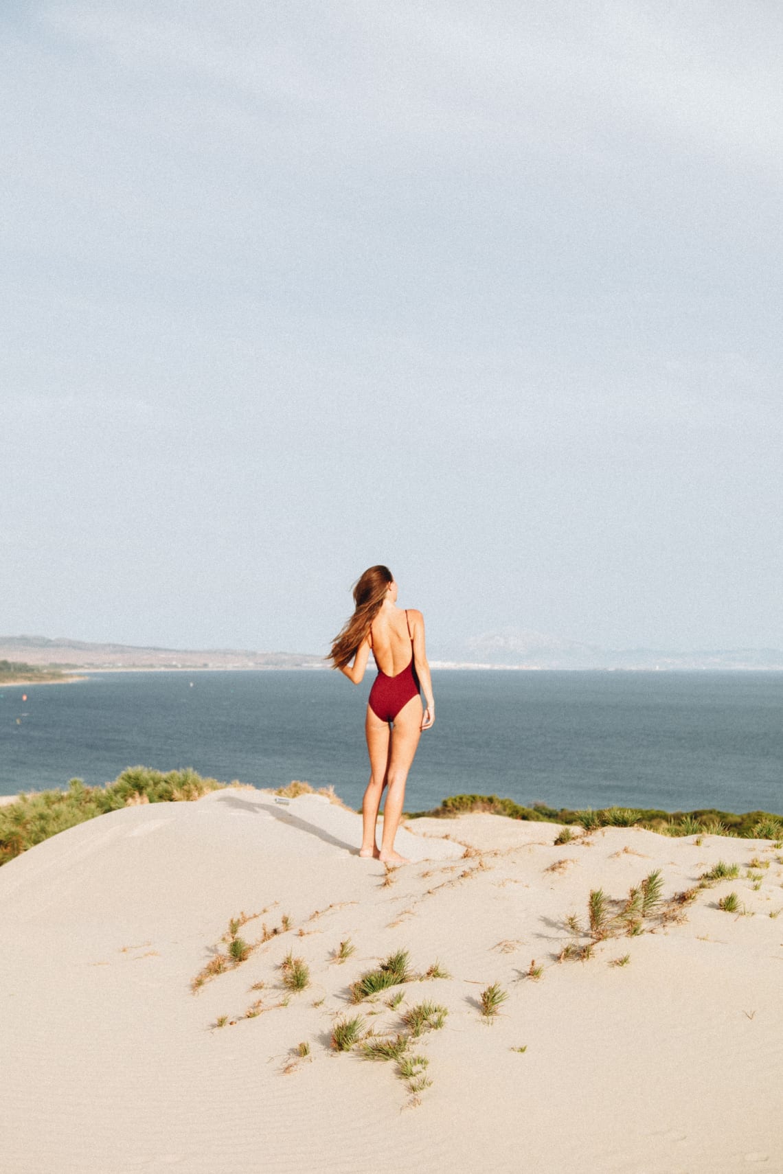 Woman standing by the sea, Tarifa, Spain