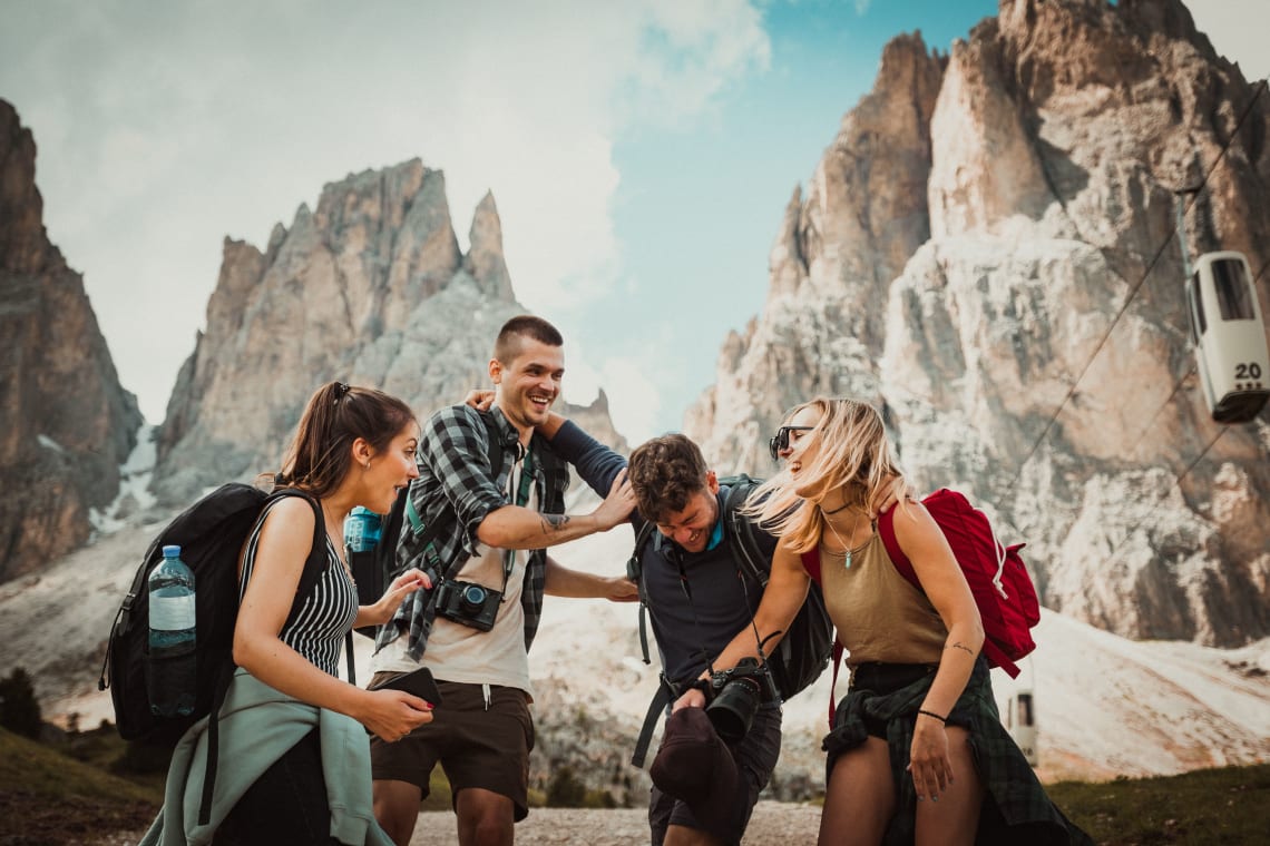 Friends with backpacks having fun together