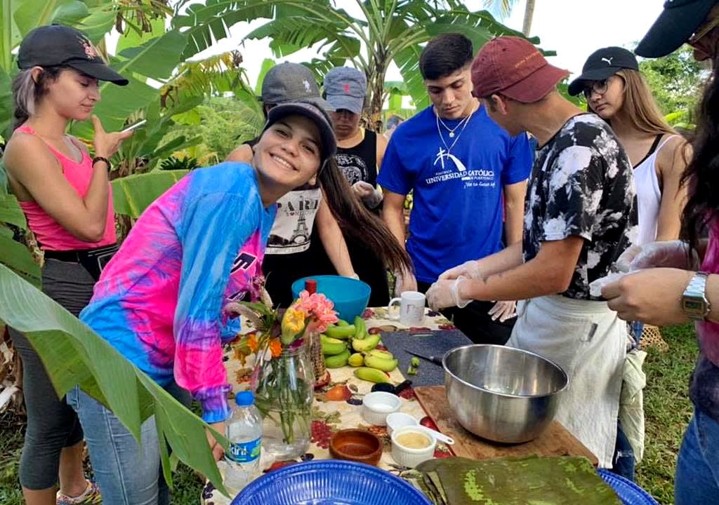 Group of volunteers preparing food in an organic farm of Puerto Rico