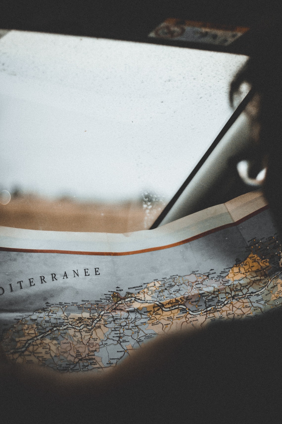 Traveler looking at vintage map