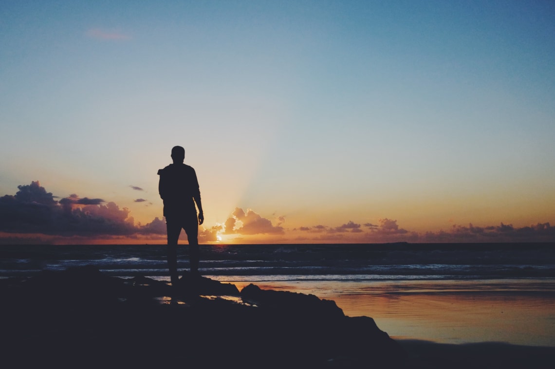 Male silhouette on the beach at sunset, Tarifa, Spain